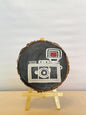 SacredFig Wooden Coaster – 4 Inch | Hand-Painted Camera Design | Artistic Tabletop Accent